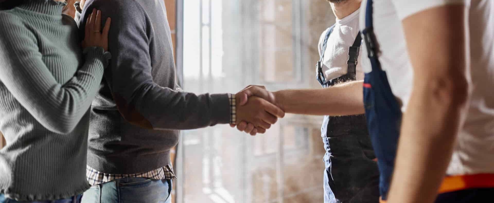 resin flooring contractor shaking hands with client